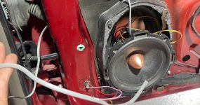 Car door with speaker being installed