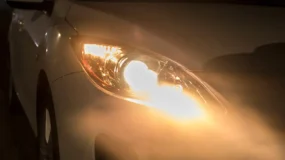 a car's headlights shining yellow
