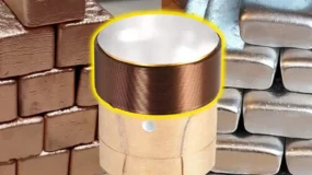 A coil of wire with gold bricks stacked on one side of it and silver on the other