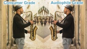 Two identical men facing each other playing a saxophone